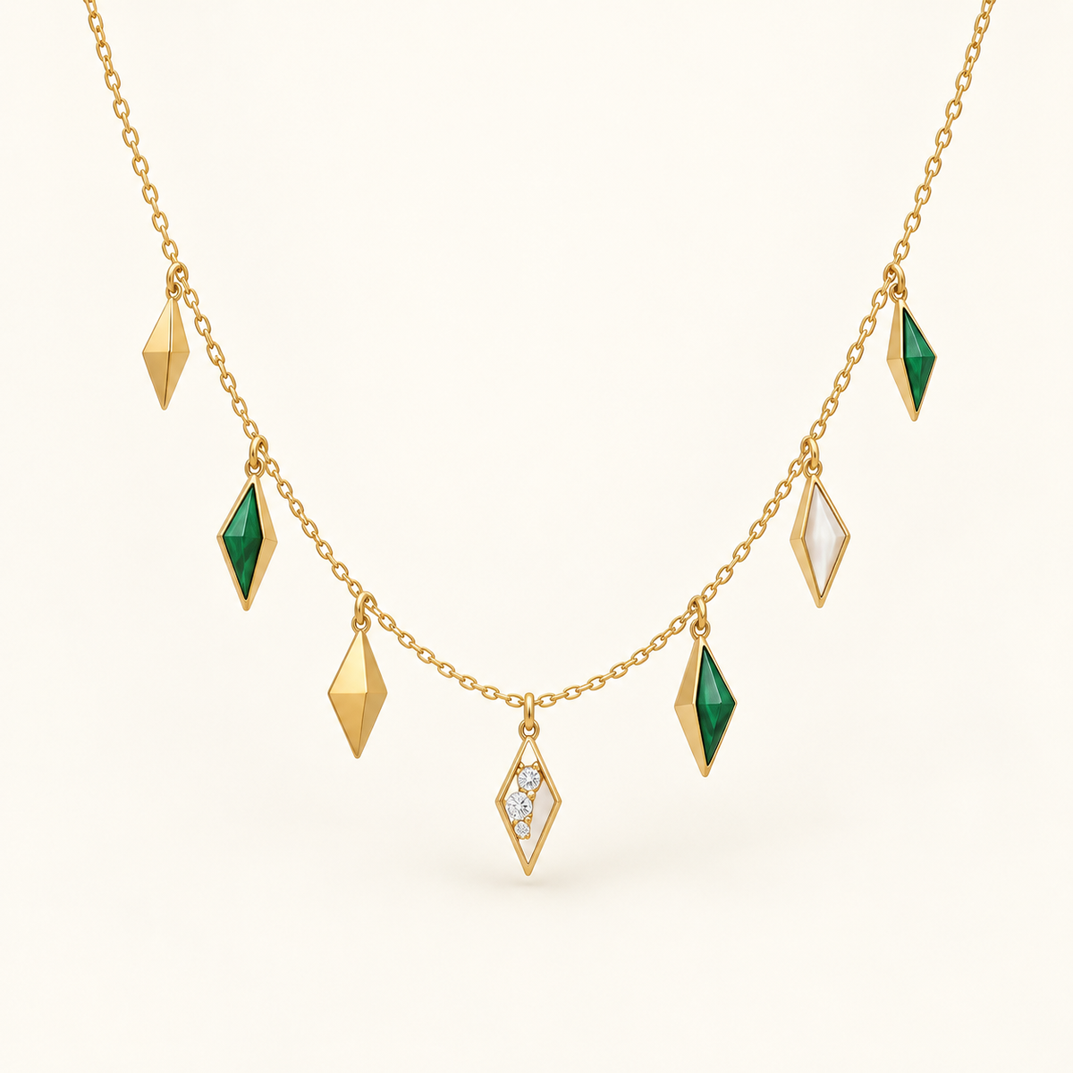 Marrakech Five-Talisman Necklace, a green, gold, white geometric necklace