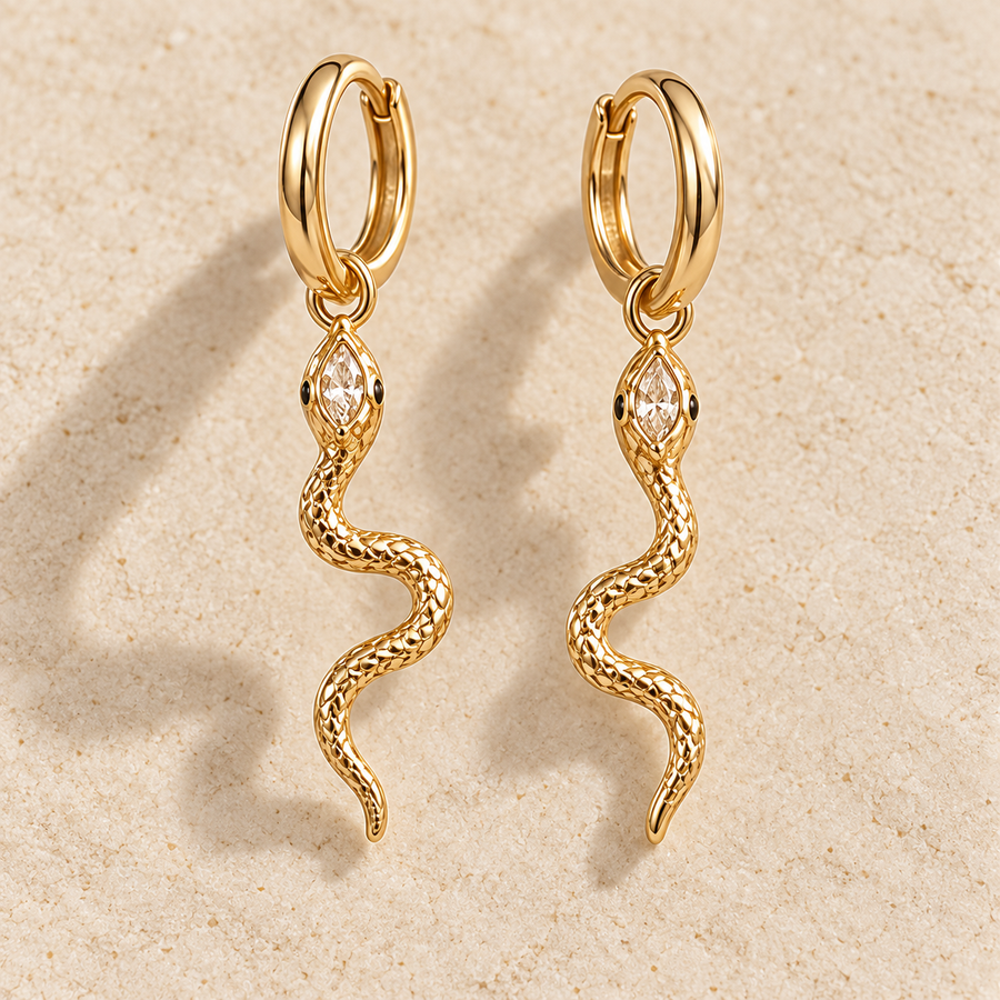 Naia Serpent Huggie Drops, gold-finished hoop earrings with clear crystal snake charms