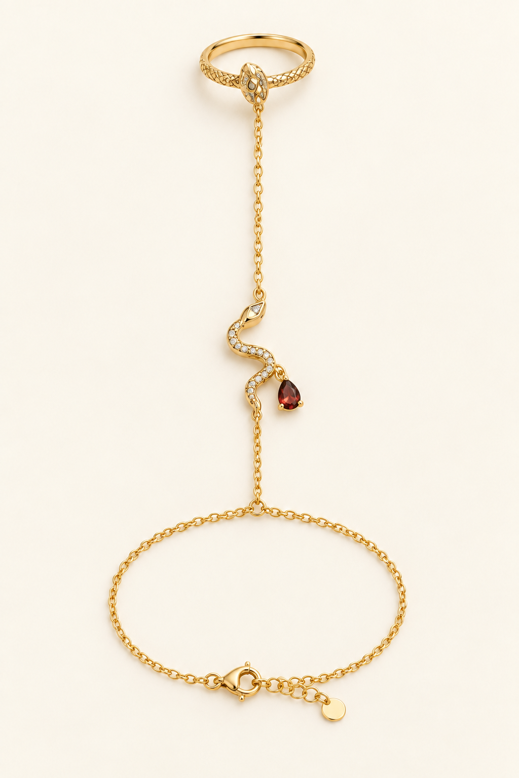 Rani Crimson-Tear Serpent Hand Chain, shown laid flat and worn, with a gold-finished chain and crimson pear accent