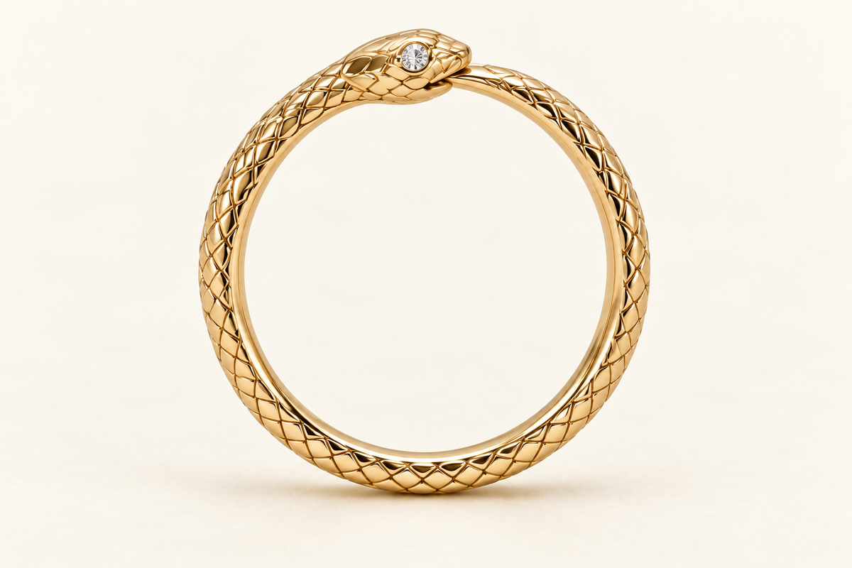 Aeternum Ouroboros Bangle, circular gold-finished snake bracelet with a round clear crystal accent
