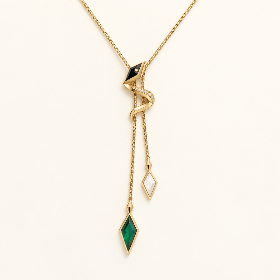 Vasuki Shadow-Prism Serpent Lariat, gold-finished snake necklace with a black head, clear crystals, and green and white prism drops