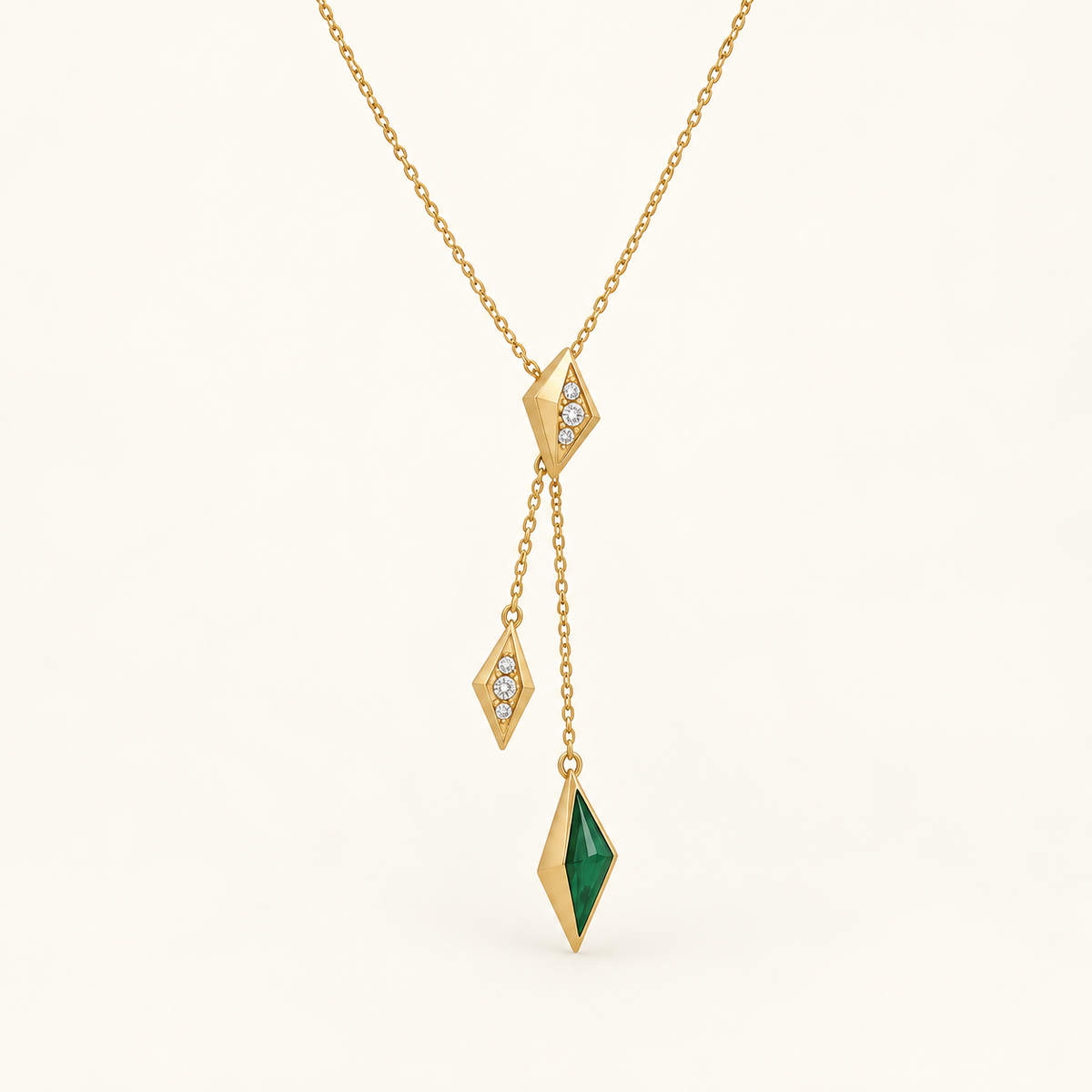 Zaria Emerald Lariat, a green, gold, white geometric necklace