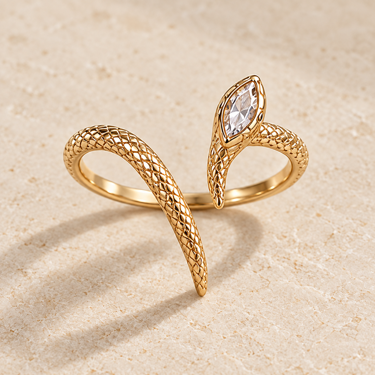 Naga Marquise Coil Ring, gold-finished scale-textured snake ring with a clear marquise crystal