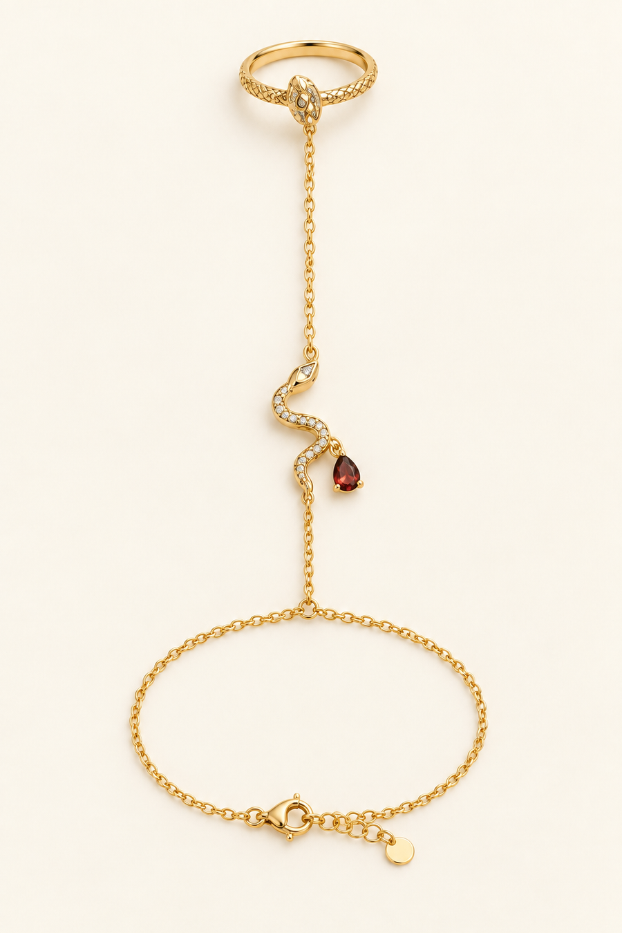 Rani Crimson-Tear Serpent Hand Chain, shown laid flat and worn, with a gold-finished chain and crimson pear accent