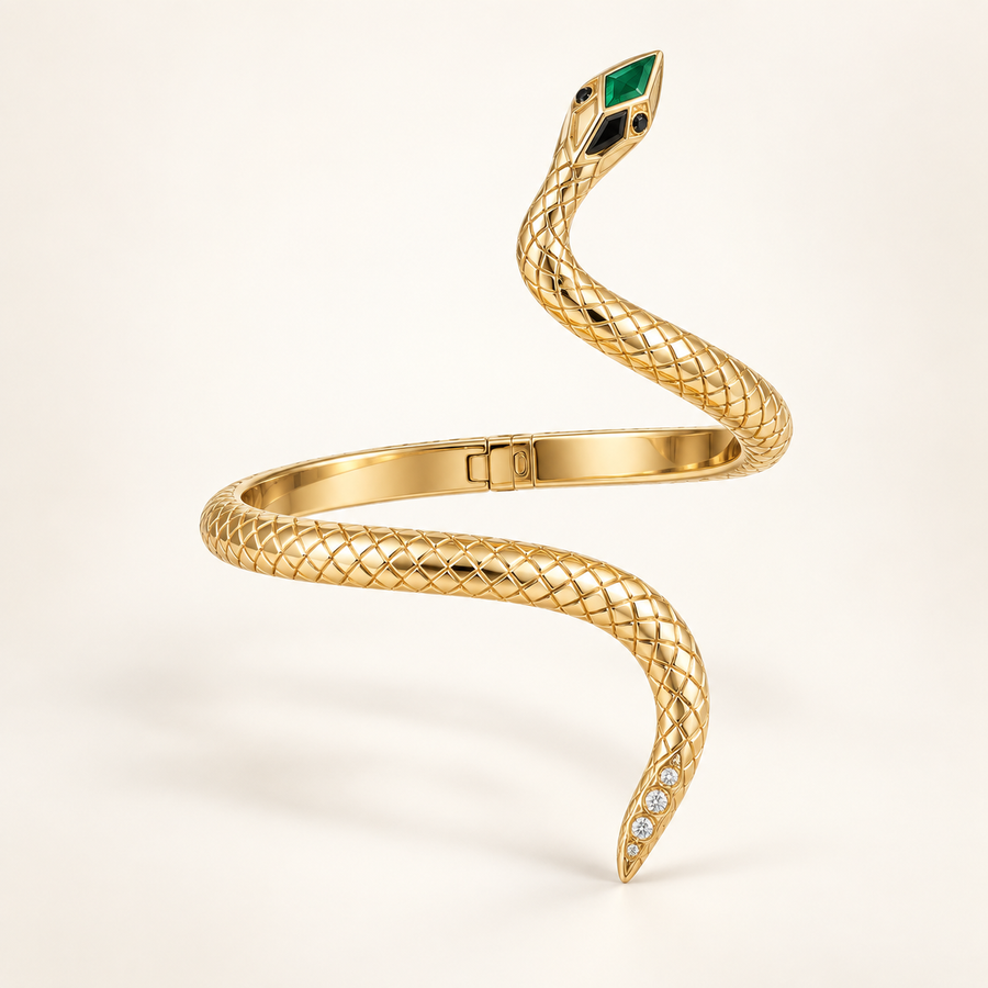 Naja Emerald-Crown Serpent Arm Cuff, scale-textured gold-finished snake bracelet with green, black, and clear accents