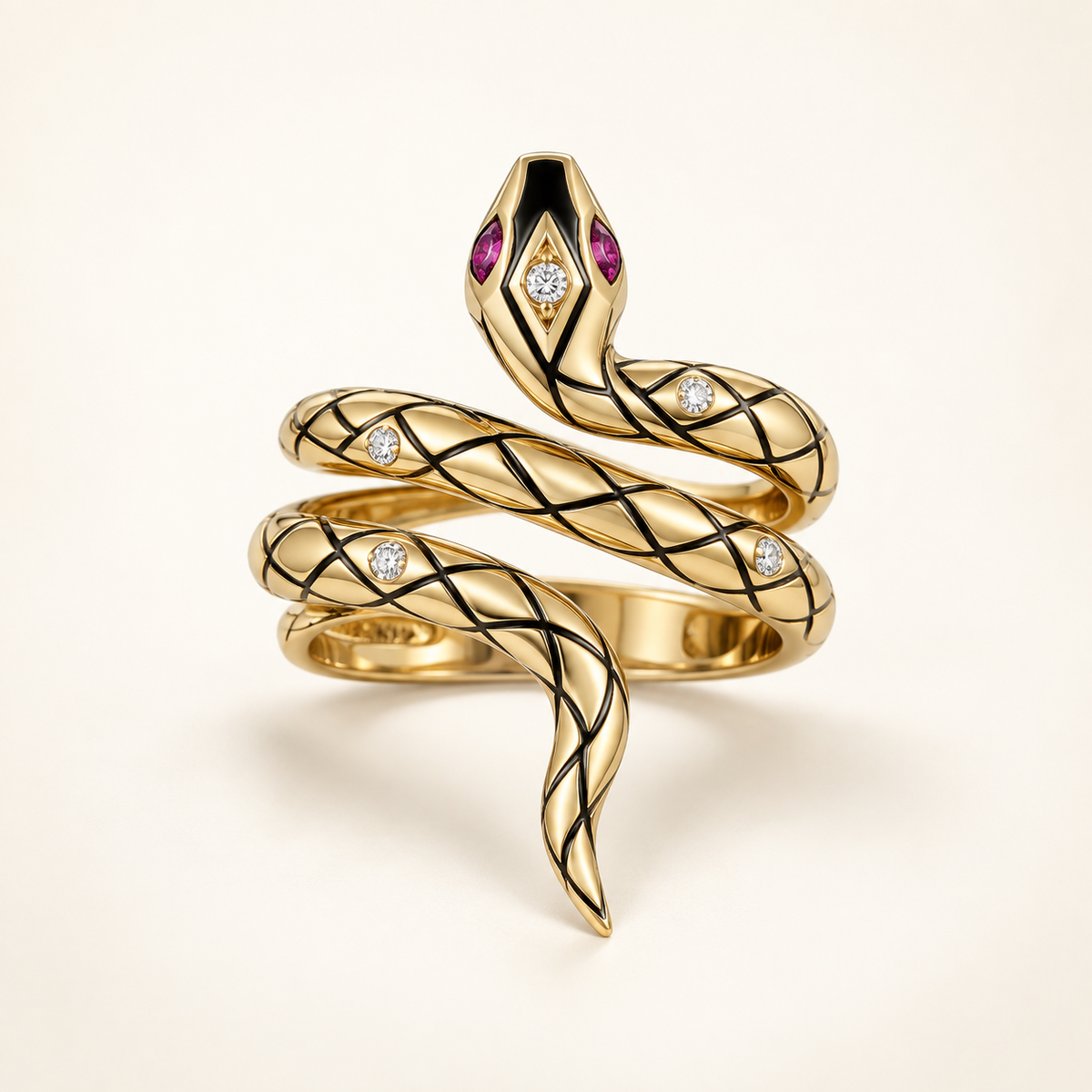 Kaliya Ruby-Gaze Cobra Coil Ring, gold-finished coiled snake ring with black latticework, clear crystals, and pink-toned eyes