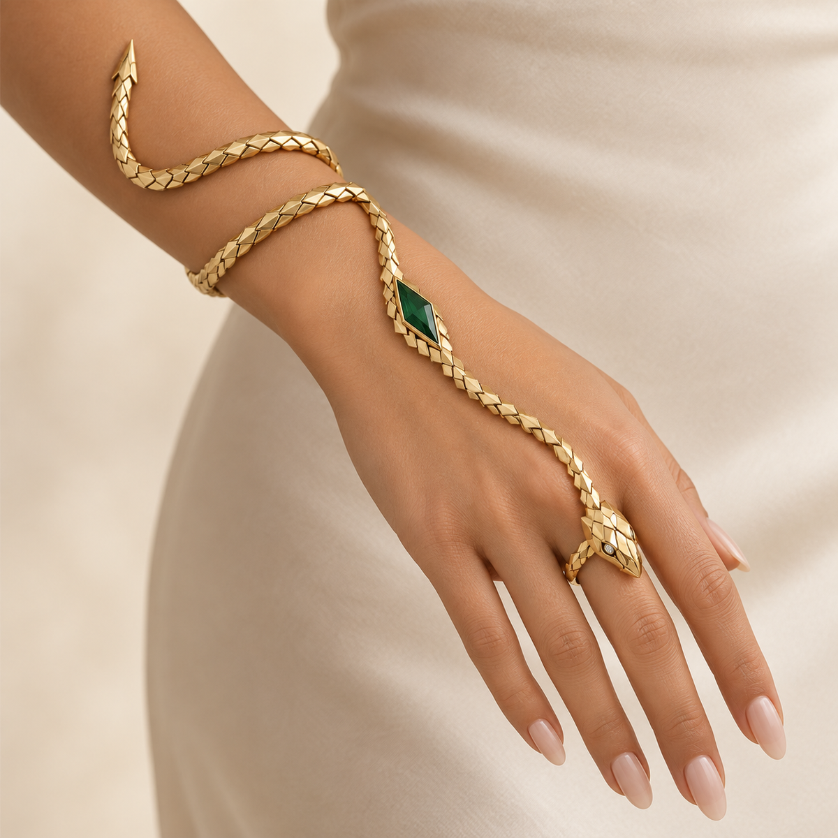 Melusine Emerald Serpent Hand Harness, articulated gold-finished snake hand bracelet with a green geometric centerpiece