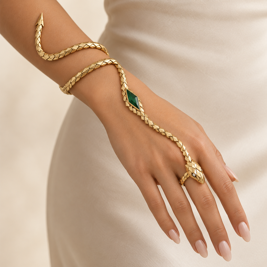 Melusine Emerald Serpent Hand Harness, articulated gold-finished snake hand bracelet with a green geometric centerpiece