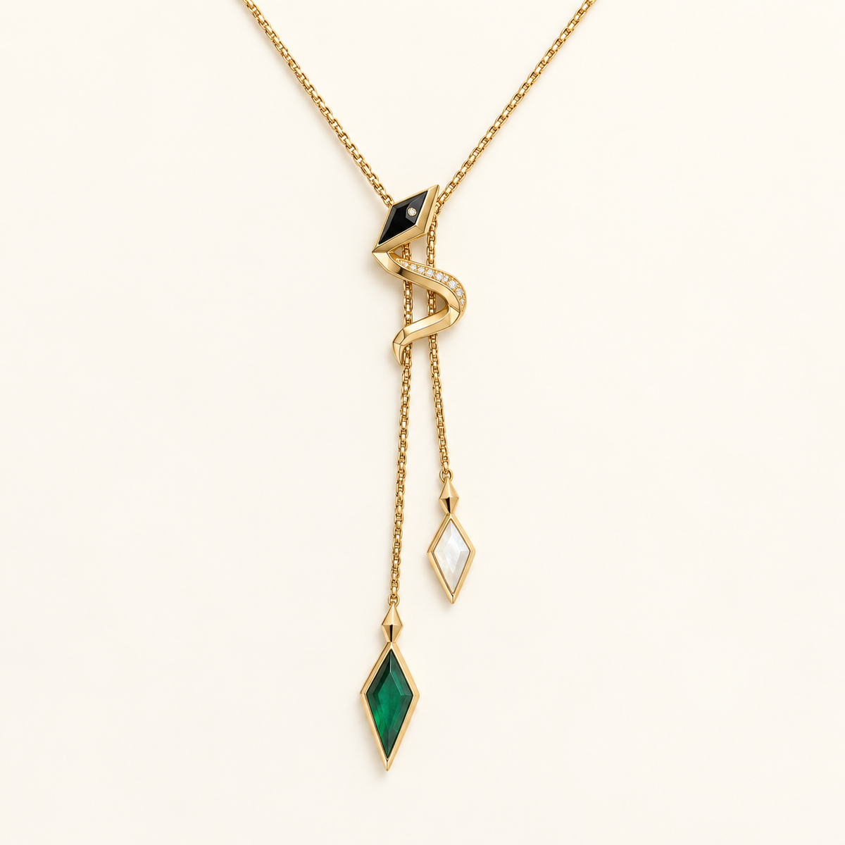 Vasuki Shadow-Prism Serpent Lariat, gold-finished snake necklace with a black head, clear crystals, and green and white prism drops